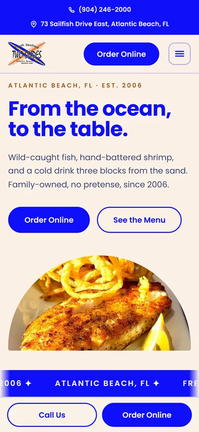 Two Dudes Seafood website shown on a phone